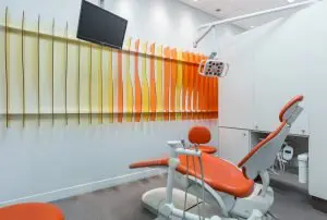 bright orange dental office and dark orange dental chair what is dental fluoride