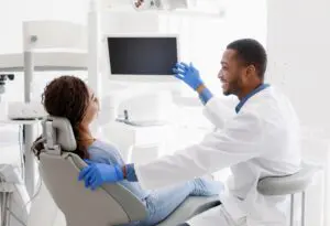 Dentist helping patient with dental anxiety