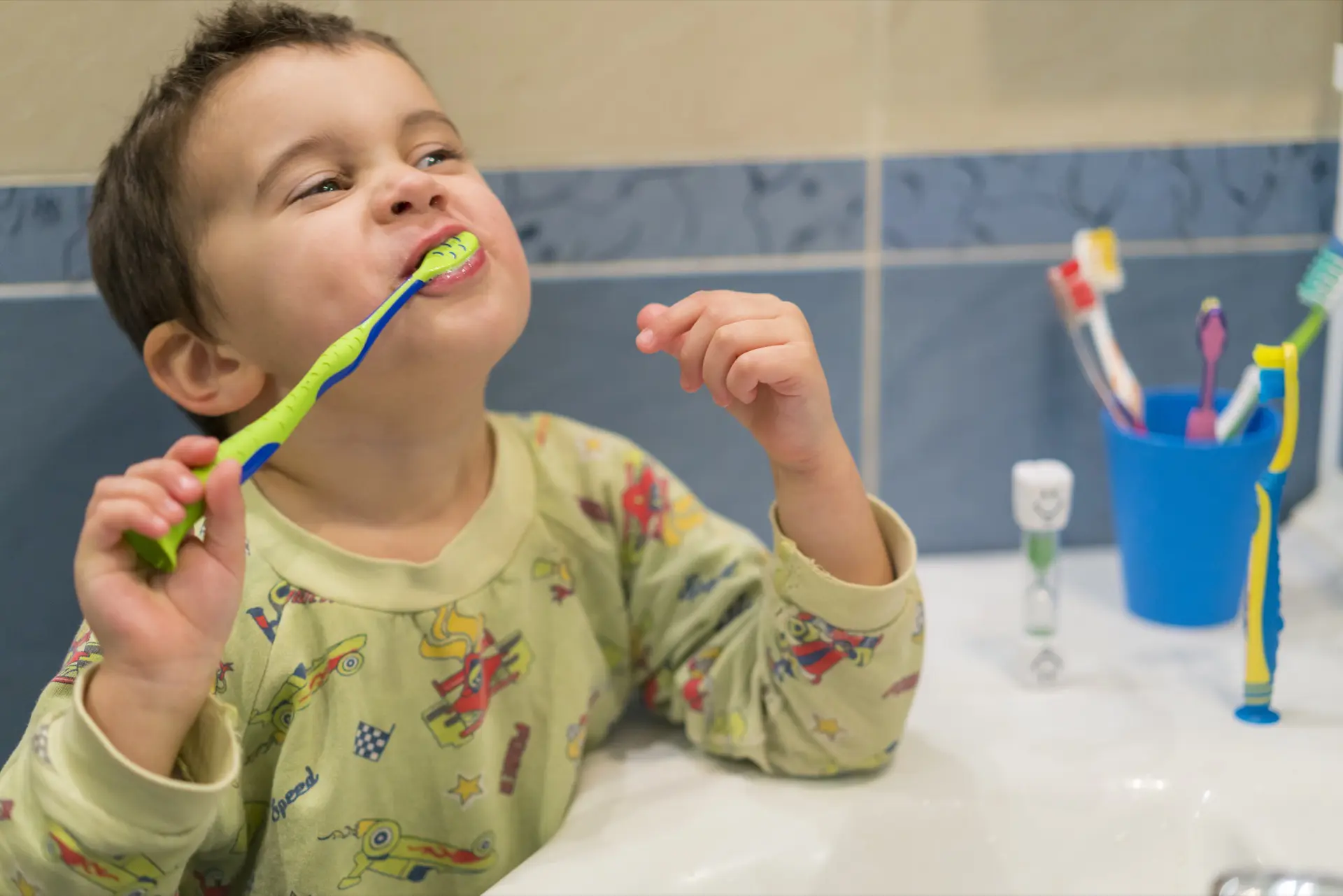 Toddler learning the proper tooth-brushing technique