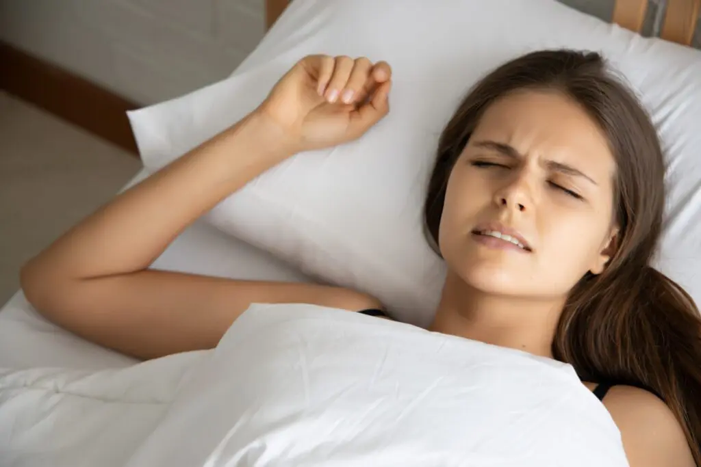 Woman clenching her teeth in her sleep