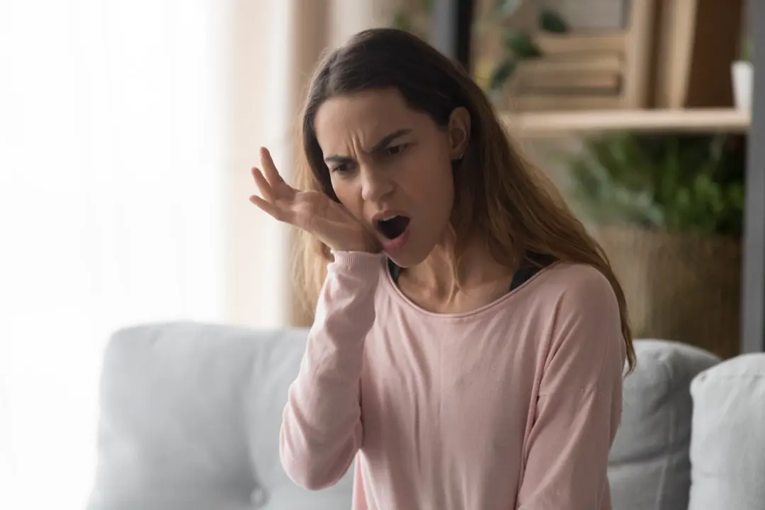 Woman suffering from jaw pain