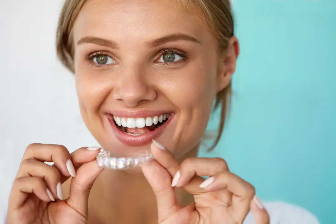 Woman having teeth whitened