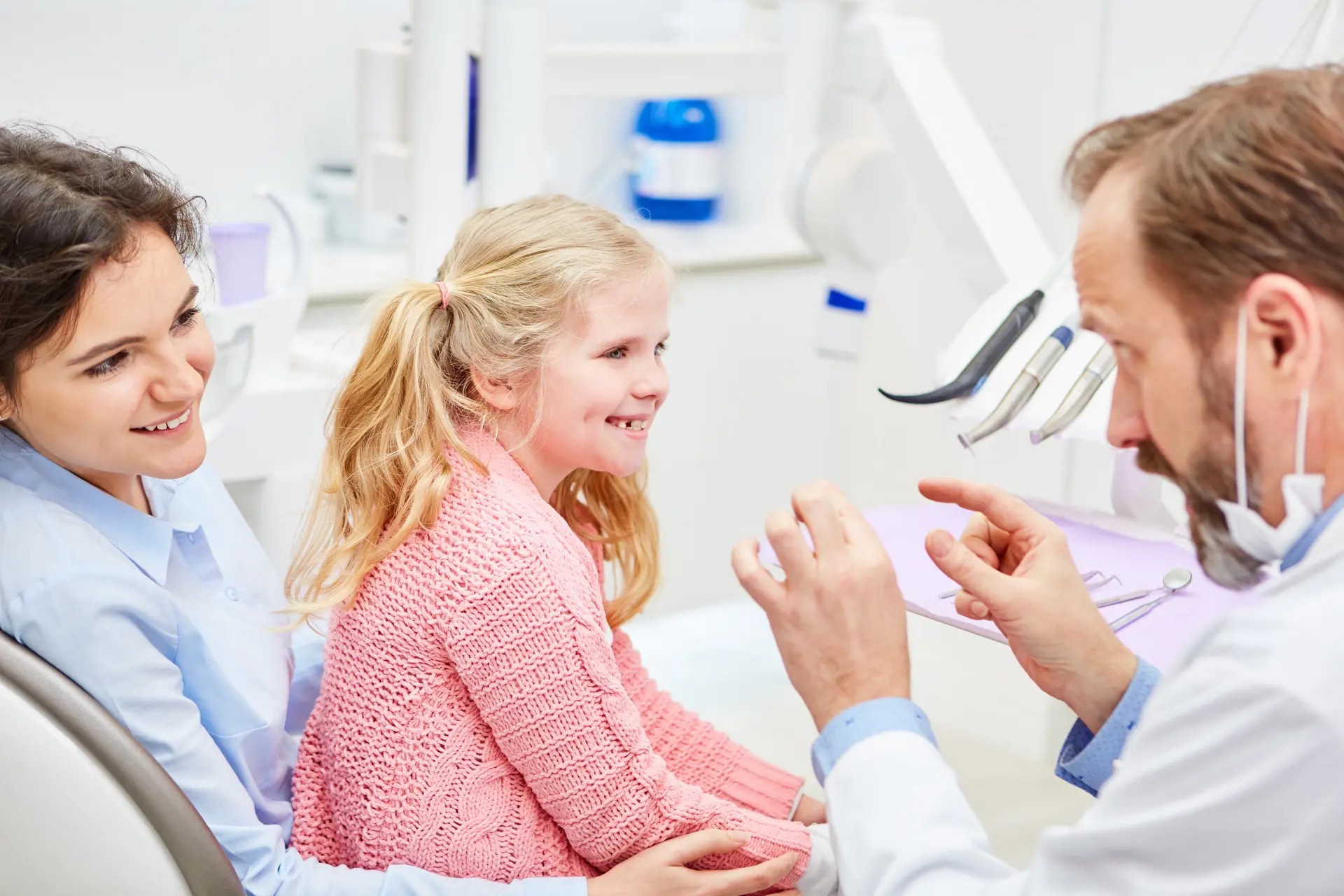 Dentist helping child overcome dental anxiety