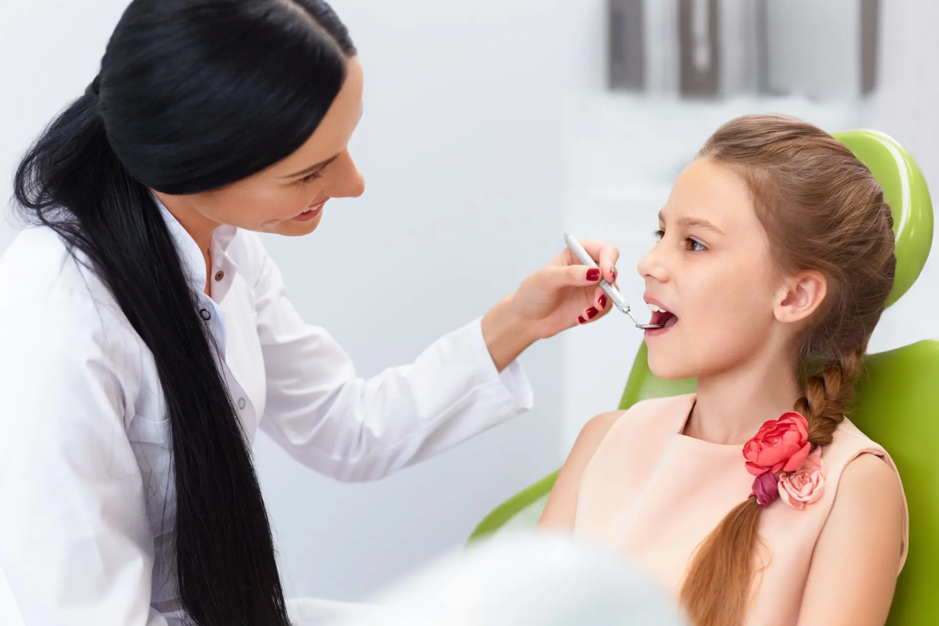 Dentist helping with dental care for kids