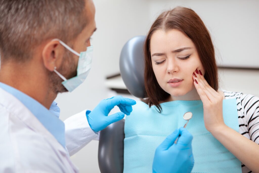 Young woman at dentist for dental emergency
